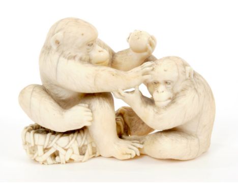 19th century Japanese carved ivory netsuke , finely carved as a pair of apes, squabbling over fruit, 7.5cm highCondition - No