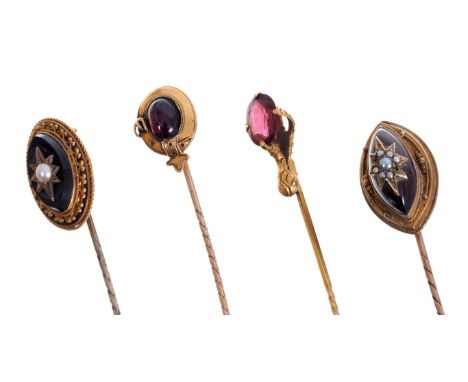 Four Victorian stick pins – to include a Victorian cabochon garnet and seed pearl stick pin, cabochon garnet and gold garter 