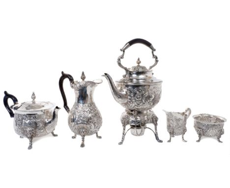 Fine quality late Victorian Irish five piece tea set - comprising silver teapot of bellied form, with embossed fruit, floral 