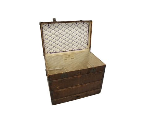 Rare early Louis Vuitton trunk, cloth, leather and wood bound with brass studs, flaking carrying handles, the hinged interior
