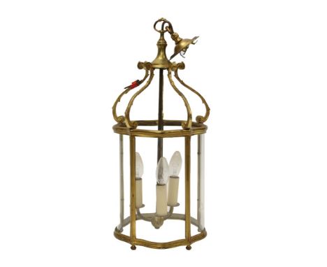 Early 20th century brass hall lantern, with serpentine form glass panels, 59cm high 