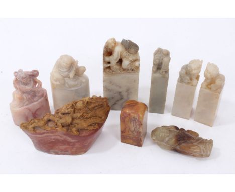 Chinese carved jade figure of a boy, reclining on an animal skin, 6cm long, together with large carved seal with fisherman te