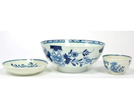 An 18th century Liverpool blue and white slop bowl and an 18th century Worcester tea bowl and saucer 