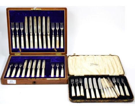 A set of Edwardian silver and mother-of-pearl handled fruit knives and forks, Sheffield 1908, one knife lacking, boxed; toget