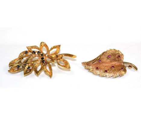 A 9 carat gold sapphire spray brooch, round cut sapphires to textured leaves, measures 6cm by 4cm and a 9 carat gold ruby set