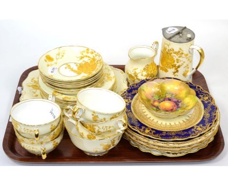Pair of crescent china cabinet plates, early 20th century, decorated with fruit, 22cm diameter; a similar pair of plates with