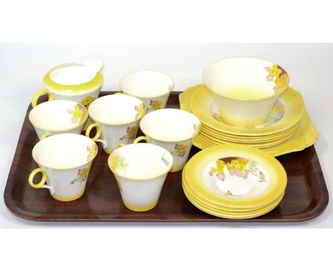 A Shelley tea service, six place settings, decorated with flowers on a yellow ground 