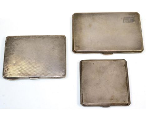 Three engine turned silver cigarette cases, the largest 12.5cm long, 13.7ozt (3) 