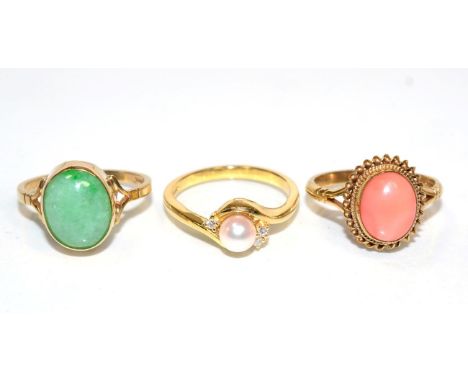An 18 carat gold cultured pearl and diamond ring, a central pearl to bypass scroll shoulders set with three round brilliant c