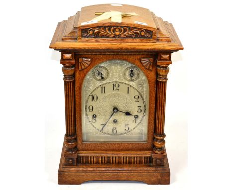 An oak chiming table clock, circa 1910 