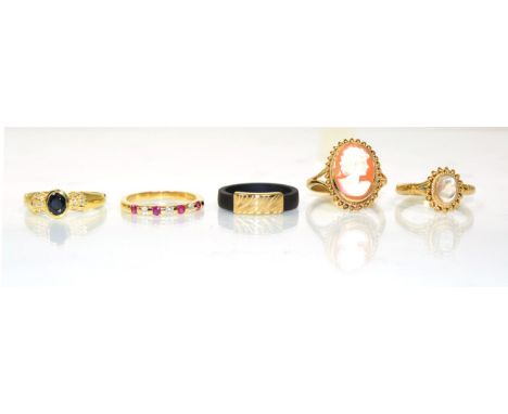 An 18 carat gold ruby and diamond half hoop ring, of channel set alternating round cut rubies and round brilliant cut diamond