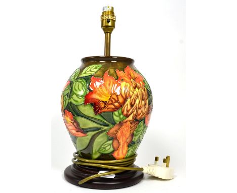 A Moorcroft pottery Flame of the Forest table lamp by Philip Gibson