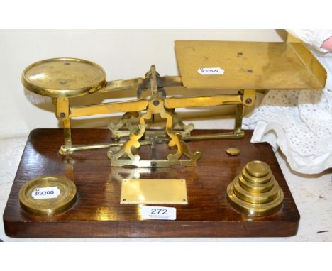 ~ A set of brass desk scales and weights on an oak plinth 