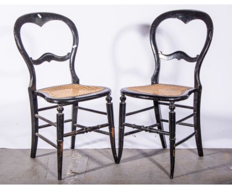 Victorian ebonised balloon-back chair, cane seat, width 41cms, height 86cm, a similar ebonised chair together with an ebonise
