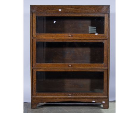 A three section Globe Wernicke bookcase,  with glazed doors, width 86cm, depth 28cm, height 115cm.