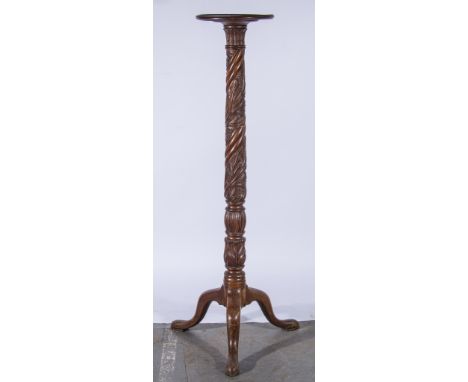 Mahogany jardiniere stand, with carved spiralling column raised on tripod pad feet, 140cm high