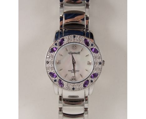 Ingersoll - a "Gems Exotic" wrist watch with mother of pearl design baton dial with wide purple and clear stone bezel, stainl