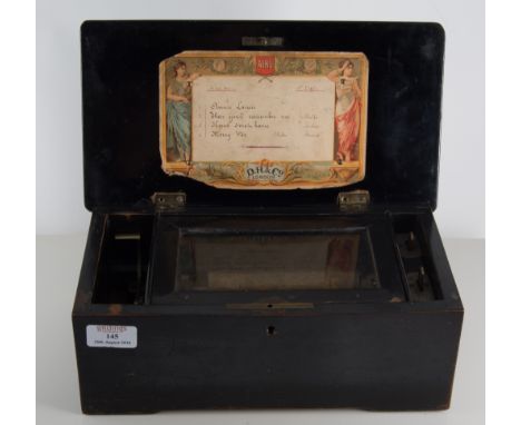 Victorian music box, with a cylinder playing four airs, in a laquered case with swan design to lid.