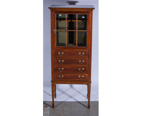 Mahogany sheet music cabinet, six paned glazed door revealing a green velvet lined interior with shelf, above four drop front