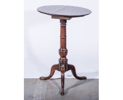 George III oak occasional table, circular tilt-top, turned column, tripod legs, the top diameter 46cm, height 67cm.