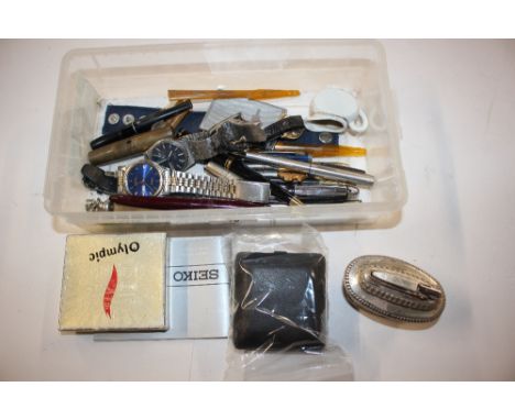 A plastic box containing various pens, wrist watches, a Ronson table lighter etc. 