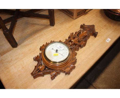 An early 20th Century oak barometer 