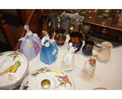 Four various figurines to include Royal Doulton, and Royal Worcester 