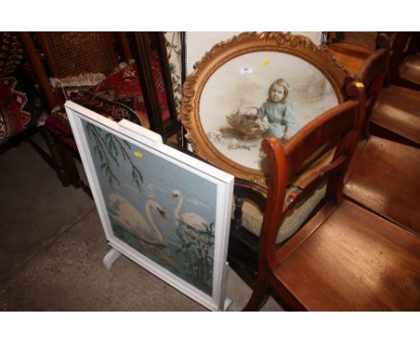 A gilt framed portrait print of a young girl; together with a fashion print and a white painted and wool work firescreen 