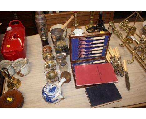 A boxed set of silver plated fruit knives and forks; together with a Victorian brass candlestick; four Georgian style silver 