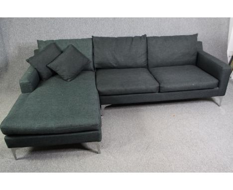 A contemporary grey upholstered corner sofa with chrome supports, H.80 W.246 D.150cm. 