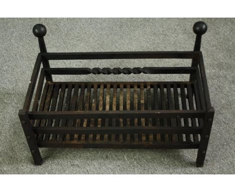 A cast iron fire grate. H.36 W.61 D.36cm. 