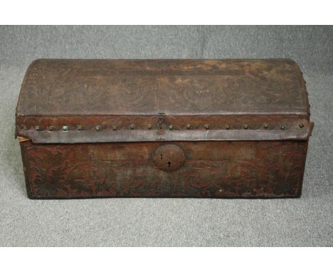 Travelling trunk, 19th century studded embossed leather. H.47 W.110 D.54cm. 
