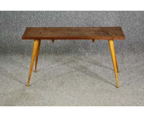 An Ercol style beech side table, with associated top and base. H.49 W.90 D.29.5cm. 