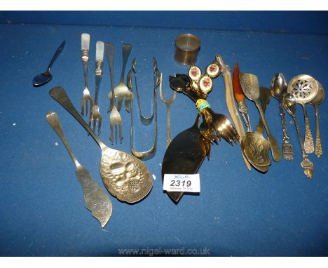 A quantity of cutlery including Japanese forks, epns sugar tongs, lizard letter opener, napkin ring, etc.