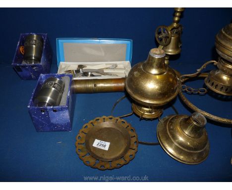 Assorted brass oil lamps and two Christening knife, fork and spoon sets.