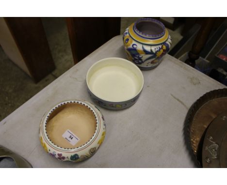 A Poole pottery baluster vase and two Poole pottery bowls