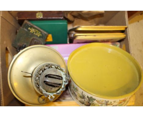 A box containing a brass oil lamp; a money box and other sundries