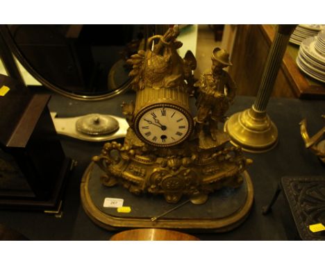 A late 19th Century gilt metal French single hole mantel clock 