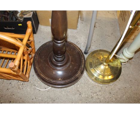 A mahogany standard lamp and a brass standard lamp