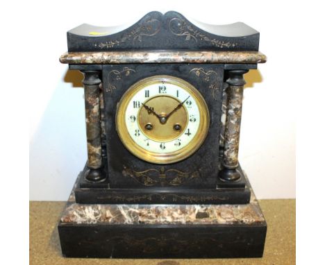 A late 19th Century black slate and marble two hole mantel clock