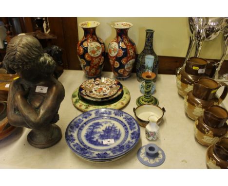 A pair of Imari vases, AF together with two Doulton blue and white transfer printed plates; a pottery candlestick etc.