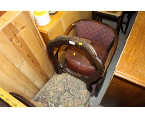 A pair of Victorian balloon back dining chairs for re-upholstery; an oak tub chair and a leather pouffe