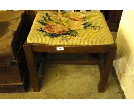 An oak and tapestry upholstered dressing stool