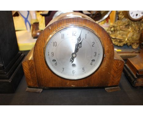An Enfield oak cased three hole mantel clock 