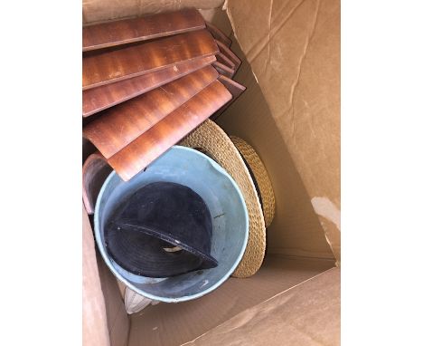 A box of misc including a straw boater, riding helmet and some wooden trays 