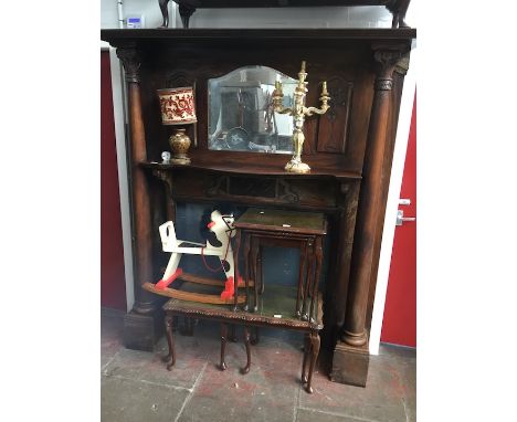 A large Edwardian fire surround with cornice top, mirror back flanked by carved panels, two pillars with Corinthian/Ionic cap