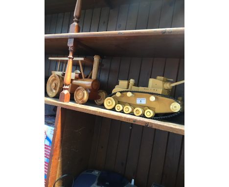 A wooden steam roller and a wooden tank. 