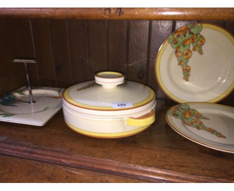 Clarice Cliff Bizarre Sunshine pattern tureen and two plates and an A.J. Wilkinson Sunny Brook cake stand 