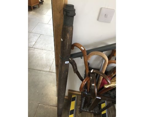 A vintage wooden tripod. 