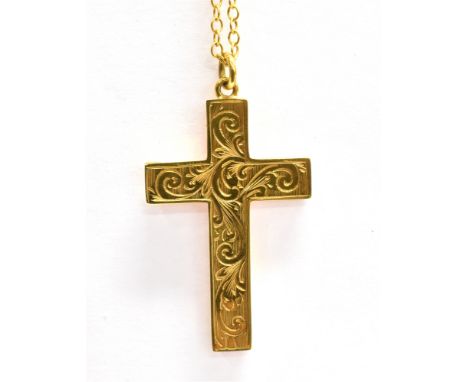 A MARKED 9CT PATTERNED CROSS  with attached unmarked chain, the cross pendant with engraved pattern, measuring 3.4 x 2.2cm, f